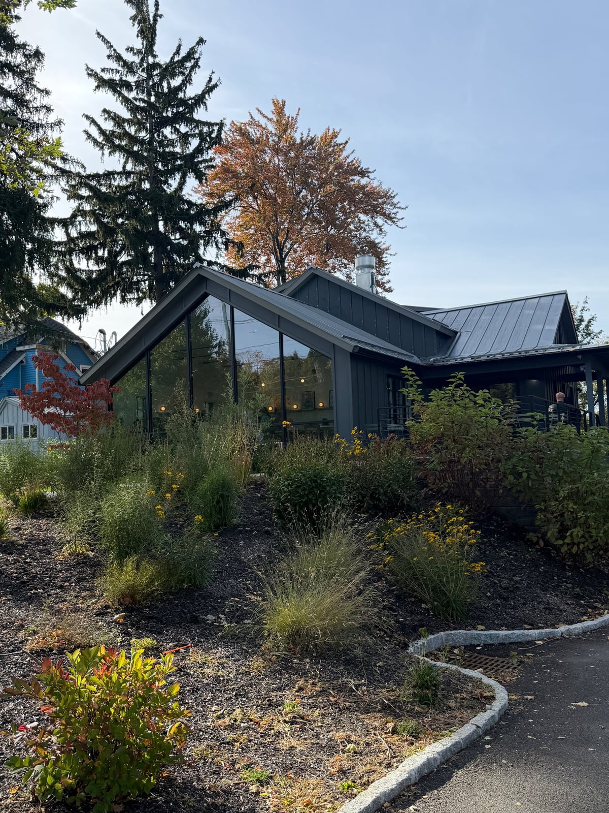 Little Loaf Bakeshop building with fall trees in New Paltz, New York