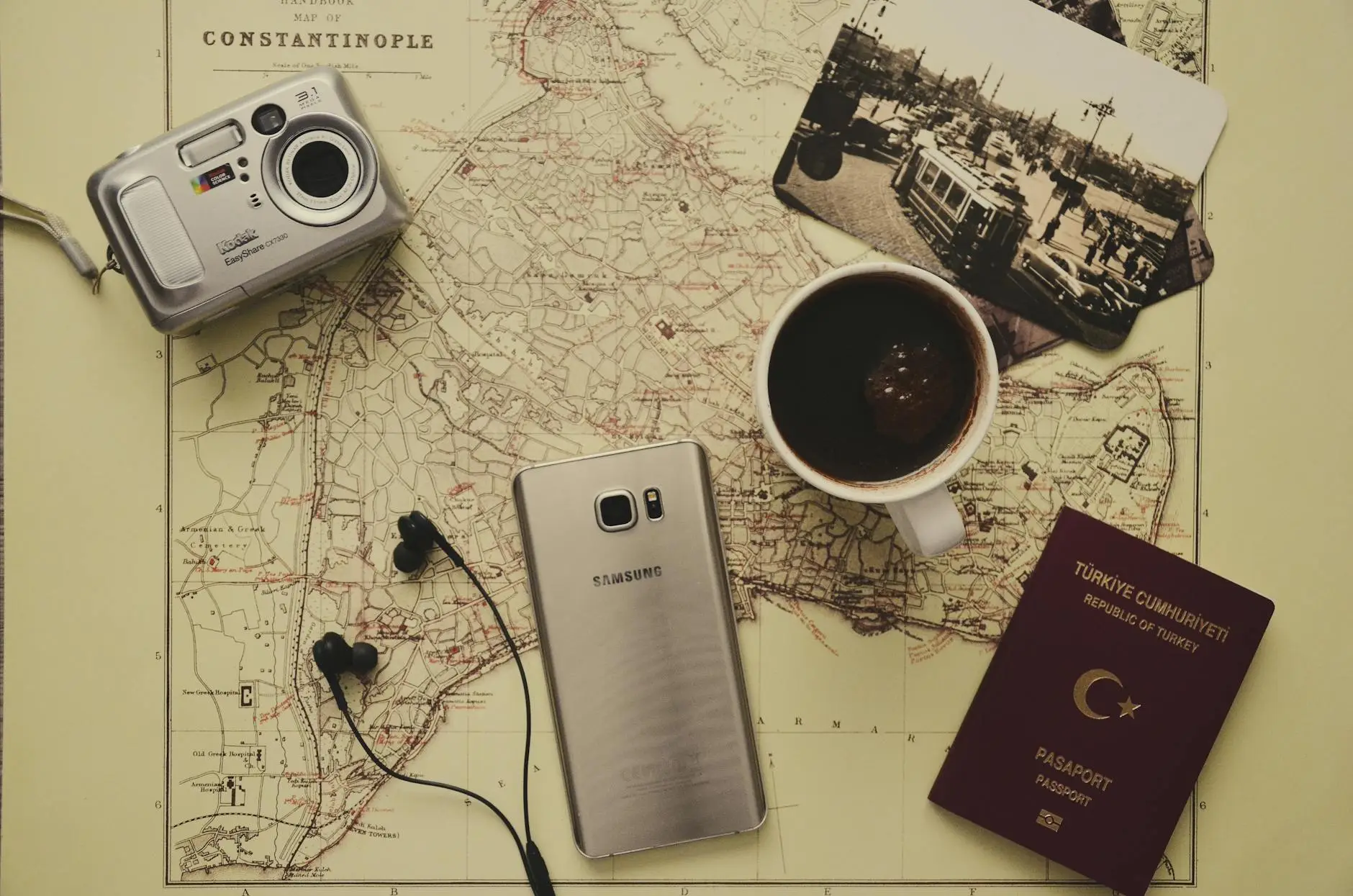 Notebook and camera packed for a morning flight