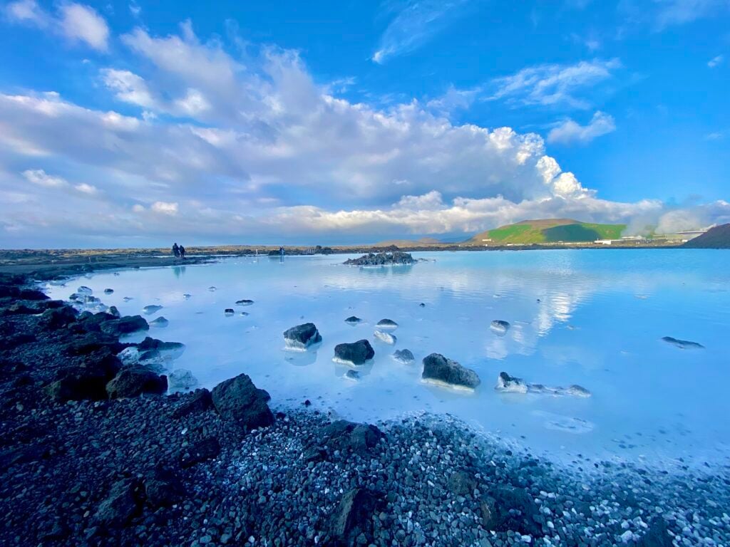 Milky blue geothermal water and dark lava rock at the Blue Lagoon