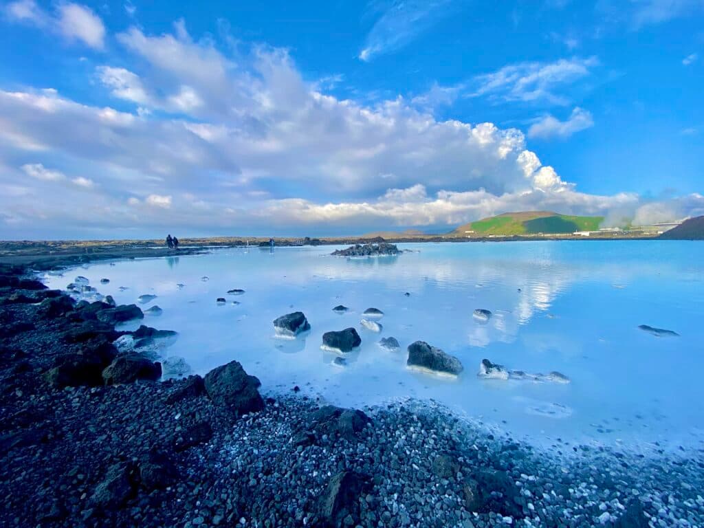 Milky blue geothermal water and dark lava rock at the Blue Lagoon