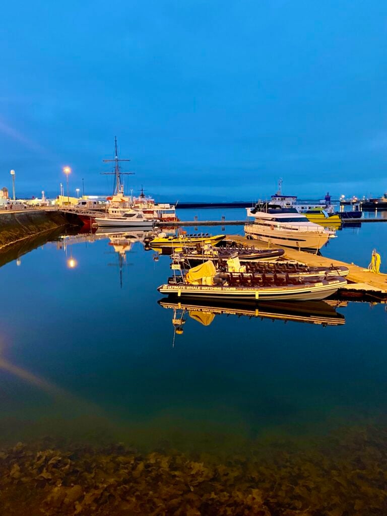 Boats in Reykjavík’s old harbor, still bright late at night under the midnight sun